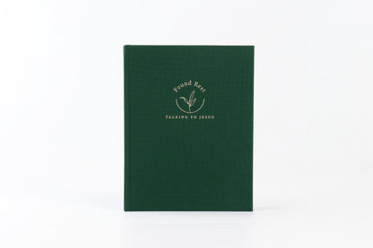 A green journal with the title 'Found Rest' written on the cover in a gold script.