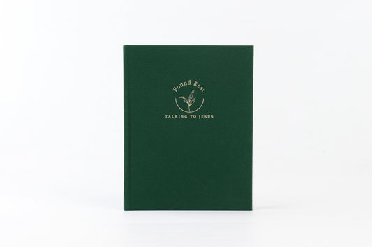 A green journal with the title 'Found Rest' written on the cover in a gold script.